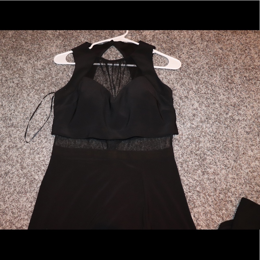 prom dress in the color black. with a slit on the side. mesh.